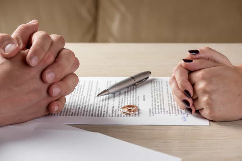 A Couple Signing Divorce Papers